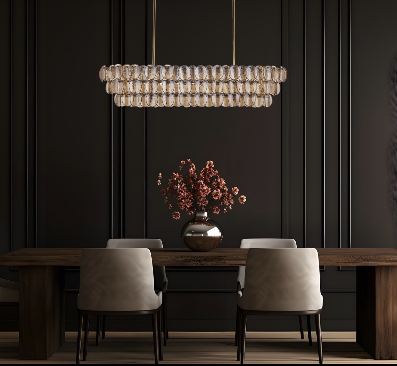 Dark dining room with a wide three-tier oval chandelier made from clear and amber glass pieces