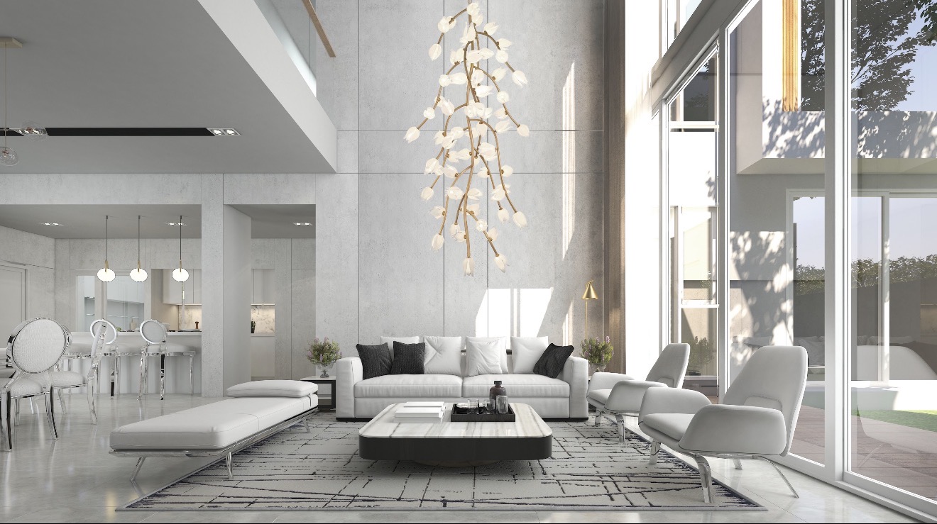 Bright double-height white living room with a cascading gold branch chandelier and glowing white leaves